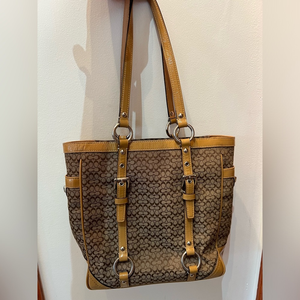 Tan coach purse, signature pattern